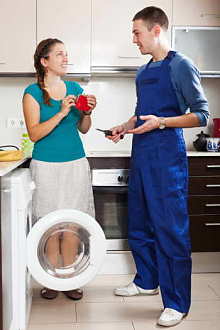 Housewife paying repairman for work